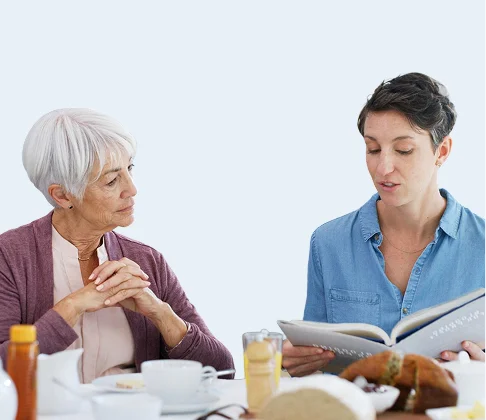 Caregiver discussing a care plan with a senior woman